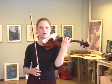 Terhi Paldanius formulates her question with violin and bow in her hands